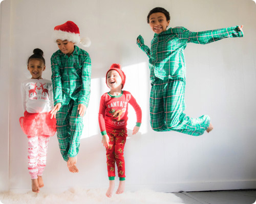 Kids jumping on bed