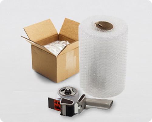 Tape gun, bubble wrap and a empty box