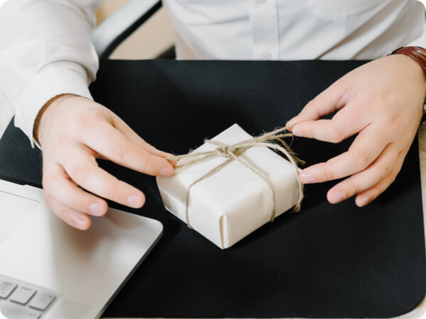 Gift wrapping a parcel for delivery